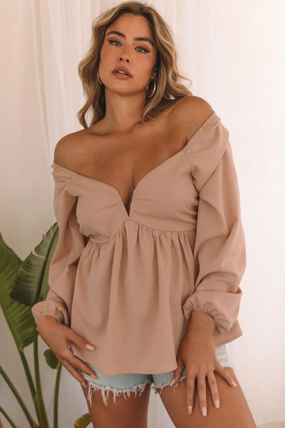 Notched V-Neck Smocked Back Peplum Blouse