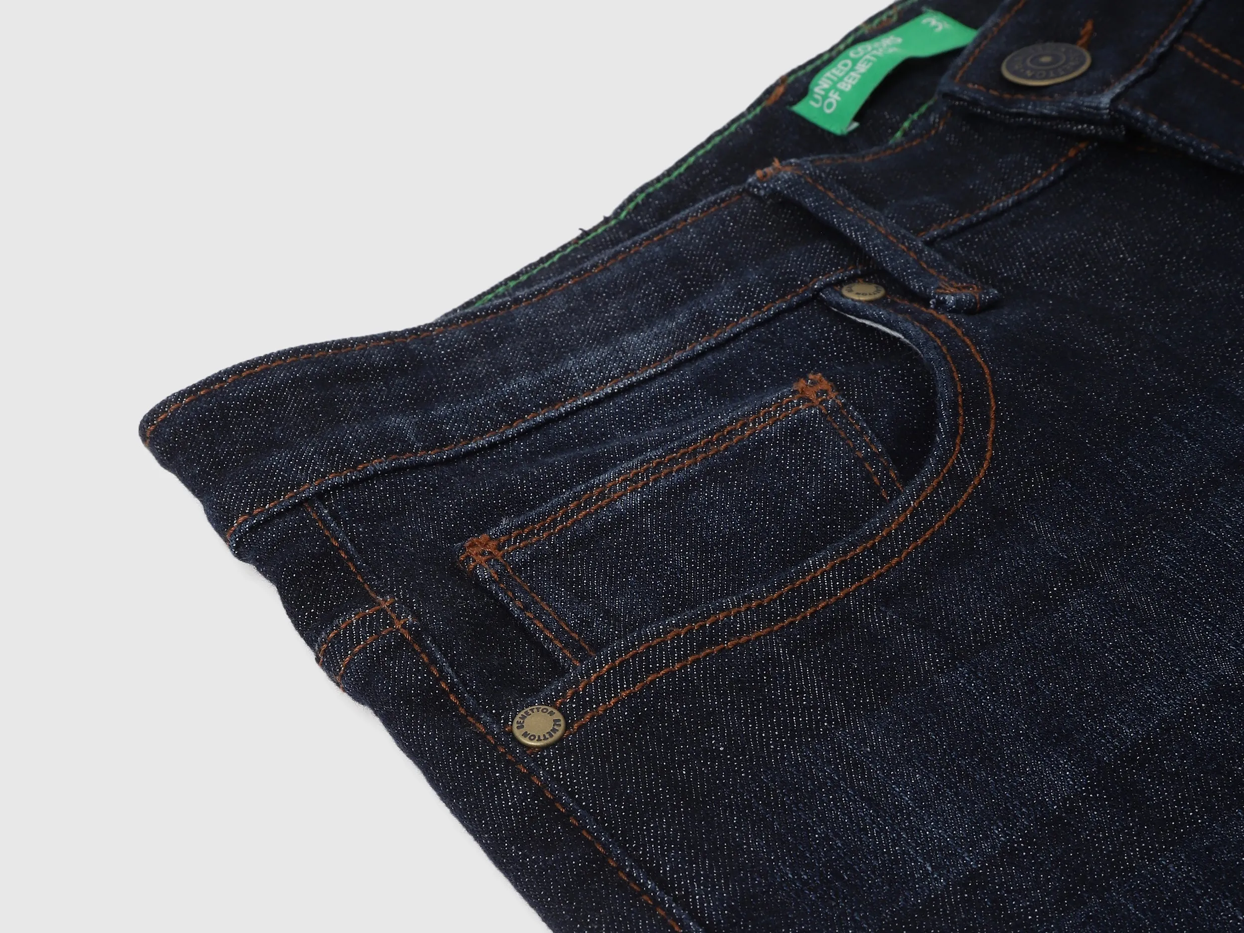 Solid Mid Rise Slim Tapered Fit Jeans