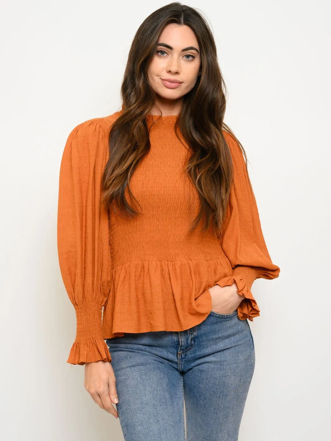 WOMEN'S WOVEN SOLID SMOCKED LONG SLEEVE PEPLUM TOP